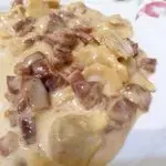Ricetta Cappelletti in crema di parmigiano e prosciutto crudo