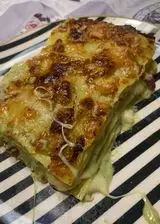 Ricetta Lasagna al pesto pancetta e scamorza affumicata