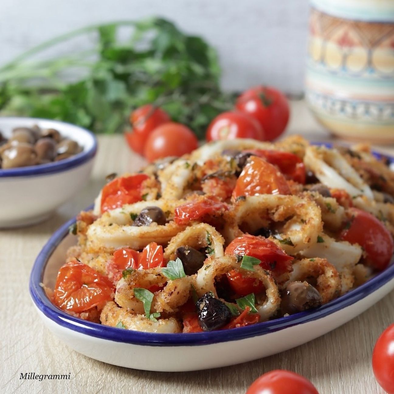 Calamari gratinati con pomodorini e olive