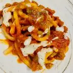 Ricetta Pici con ragù di salsiccia e  salsa al parmigiano