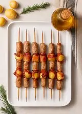 Ricetta Spiedini di salsiccia e patate al forno