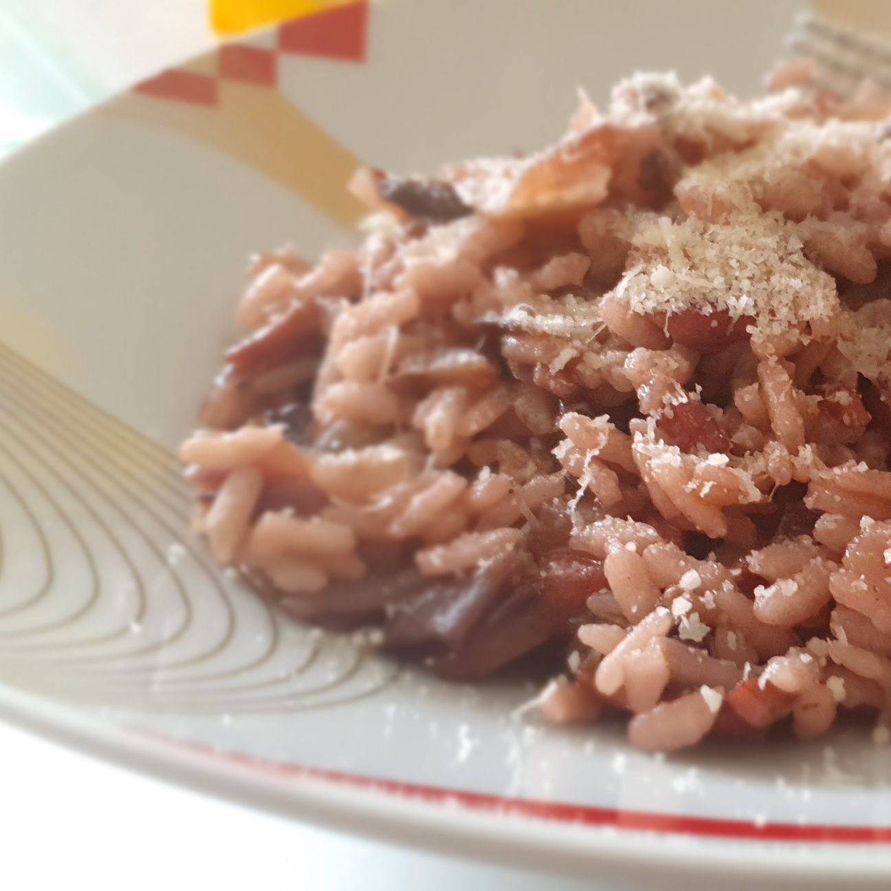 Risotto al radicchio e salsiccia mantecato con provola affumicata