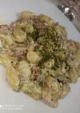 Ricetta Gnocchi speck e pistacchio