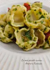 Ricetta Gnocchi al pesto di rucola con pomodorini confit