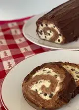 Ricetta Rotolo di pandoro e nutella con crema al pistacchio e gocce di cioccolato