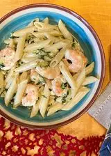 Ricetta Penne con gamberetti, puntarelle al profumo d'arancia