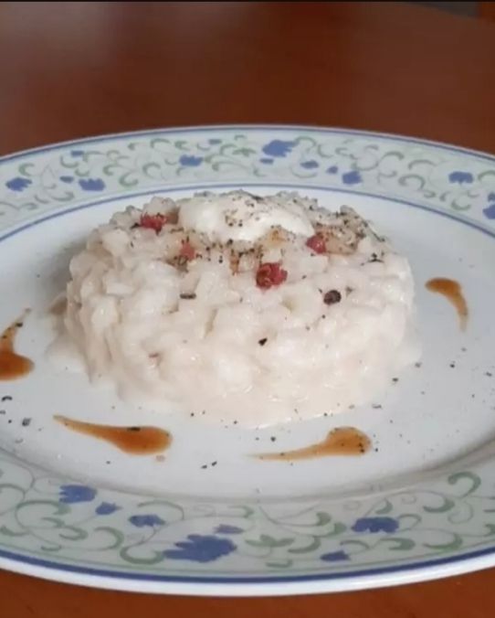 Risotto cacio, pepe, crema di bufala e riduzione al moscato