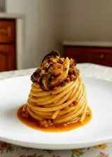 Ricetta Spaghettoni ai funghi porcini in ragù di salsiccia