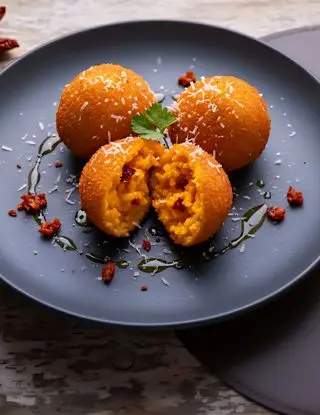 Ricetta Arancini di riso alla zucca e peperone crusco di osteriadalele