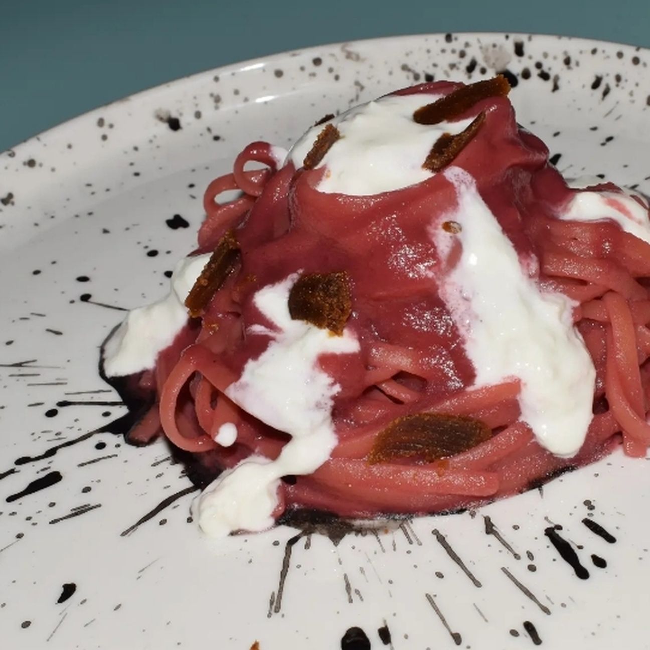 Linguine alla barbabietola con stracciatella, bottarga di muggine e nero di seppia