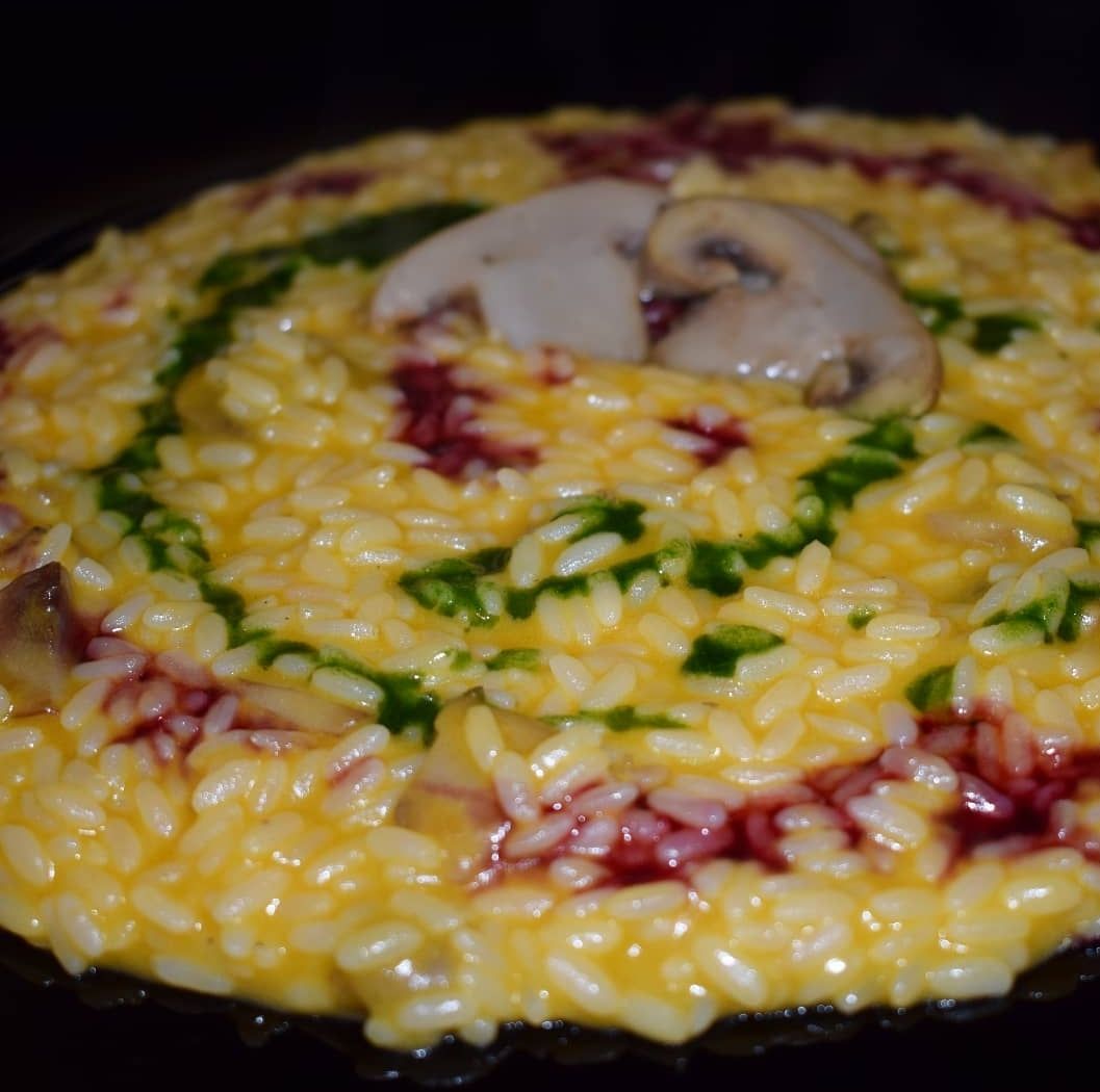 Risotto alla zucca con funghi e salsa di melagrana e di prezzemolo