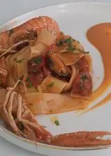 Ricetta Pappardelle agli scampi con cozze e bisque di gamberi