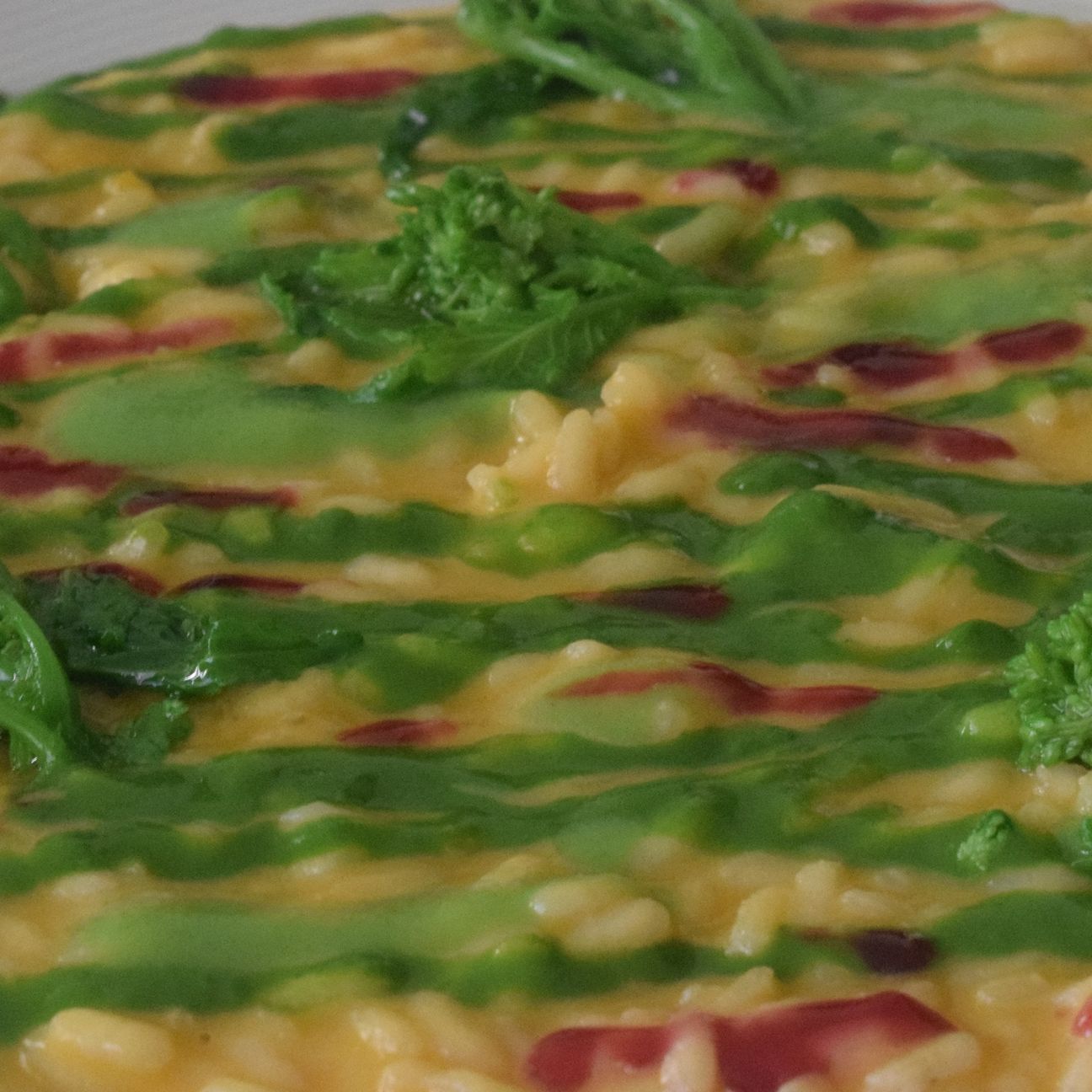 Risotto alla zucca con salsa alle cime di rapa e alla melagrana