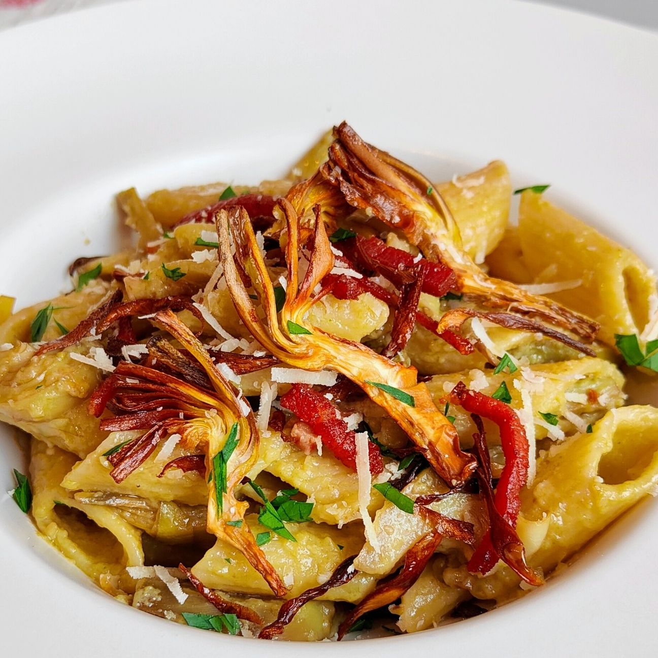 Pennoni ai carciofi e speck