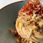 Ricetta Spaghettoni con carciofi, prosciutto crudo croccante, crema di provolone e noci