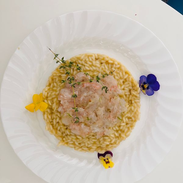 Risotto Carnaroli mantecato al limone con battuta di scampi Al.ta