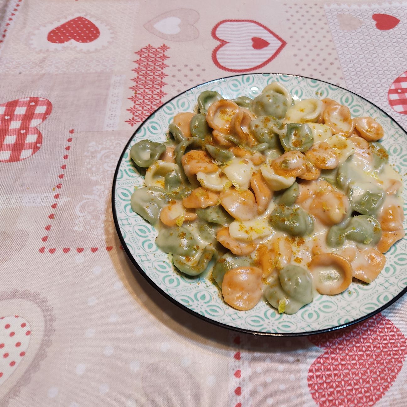 Orecchiette tricolore, crema di patata e stracchino, bottarga di muggine e scorza di limone