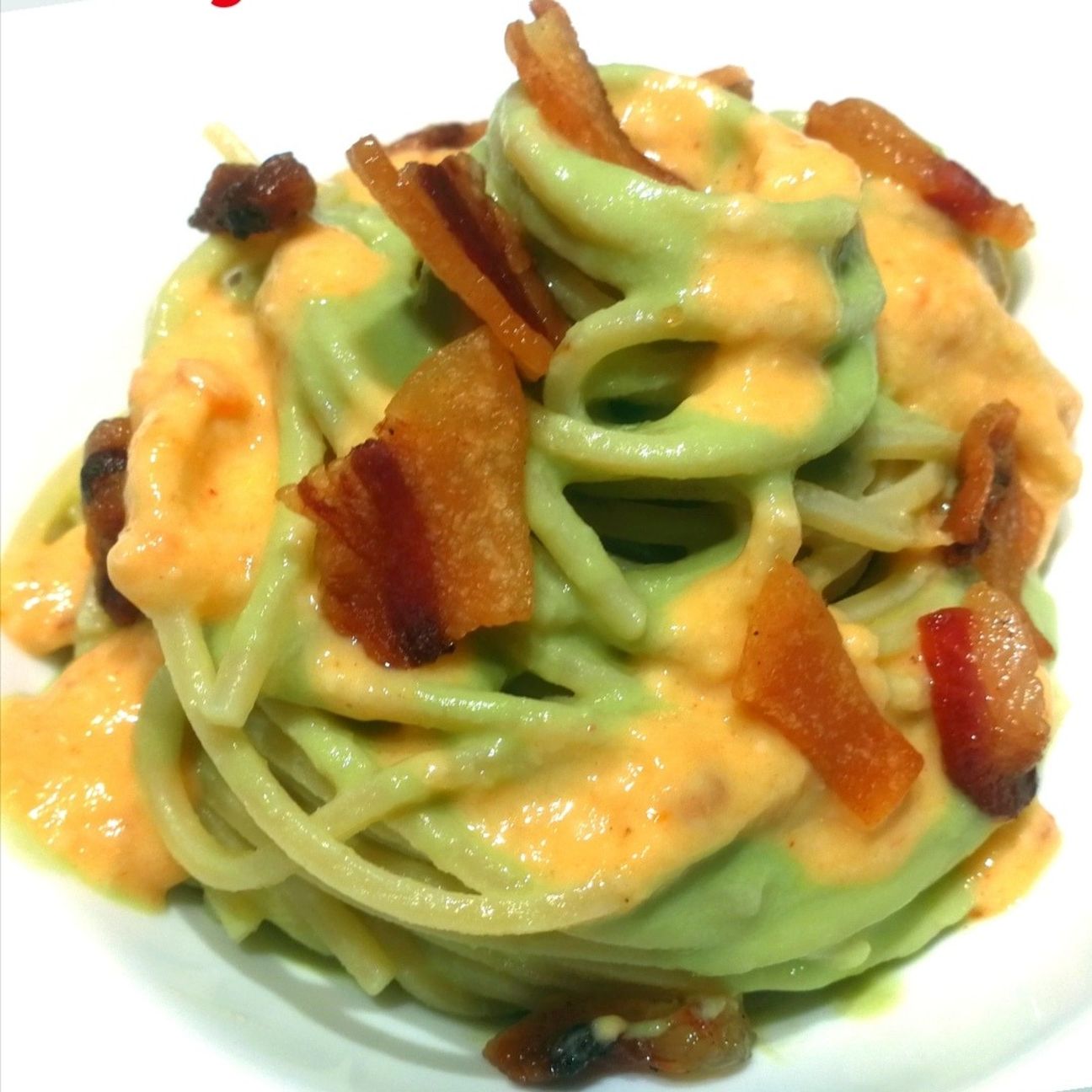 spaghettoni con crema di fave, fonduta di pecorino alla nduja, guanciale croccante