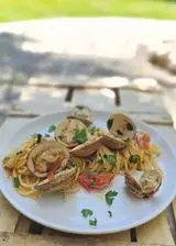 Ricetta Spaghetti con tartufi di mare e pomodori