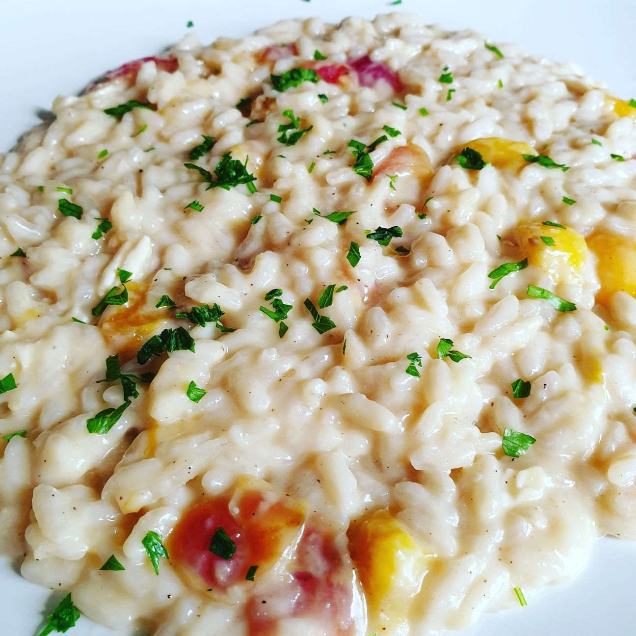 Risotto alle pesche con ciliege e zenzero mantecato al brie