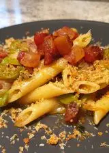 Ricetta Penne ai fiori di zucca con guanciale croccante e pangrattato tostato aromatizzato al pecorino romano