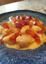 Ricetta Gnocchi di zucca in crema di taleggio al tuorlo con speck croccante e profumo di rosmarino