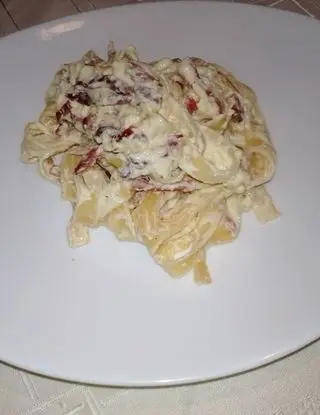 Ricetta Tagliatelle  con crema  di parmigiano 24 mesi e Speck croccante di monello