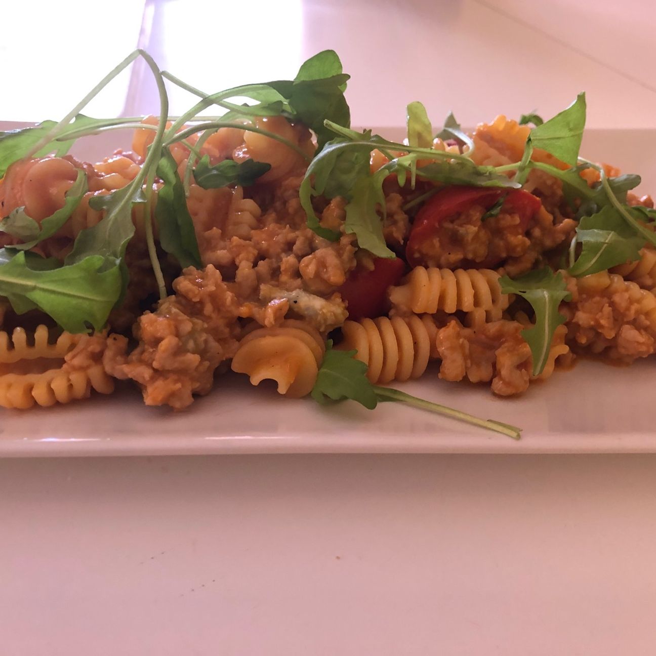 RADIATORI IN CREMA AL GORGONZOLA CON POMODORINI E RUCOLA FRESCA