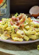 Ricetta Tortellini al prosciutto crudo con carbonara di verdure e guanciale croccante