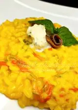 Ricetta Risotto allo zafferano con fiori di zucca e acciughe.