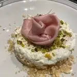 Ricetta Cheesecake salata con mortadella e granella di pistacchio