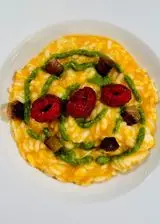 Ricetta Risotto alla zucca con affumicata, guanciale croccante, crema al basilico e lamponi