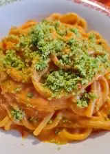 Ricetta Spaghettoni con crema di datterini e burrata con parmigiano verde