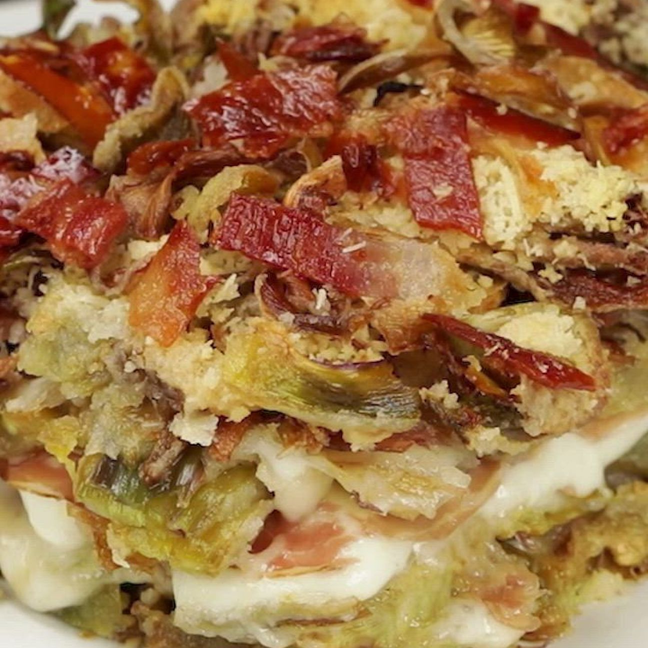 Parmigiana bianca di carciofi e speck