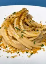 Ricetta Spaghettone XXL burro e alici con taralli croccanti al prezzemolo