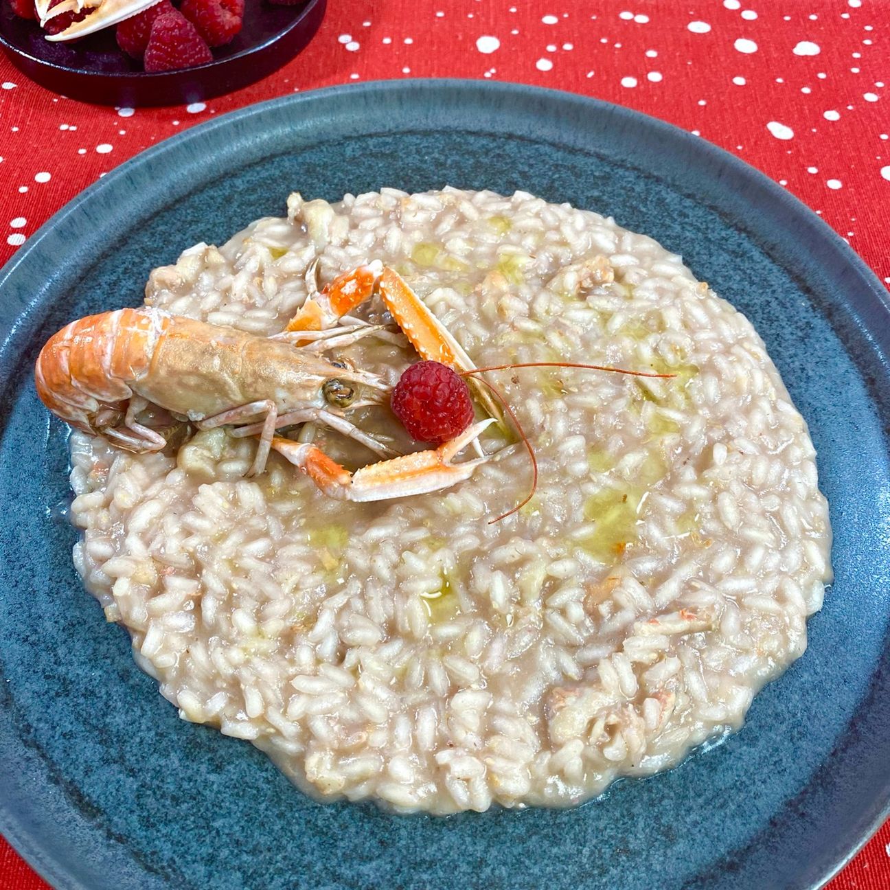 Risotto al champagne con scampi e lamponi