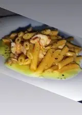 Ricetta Penne con crema di zucchine e polpa di gamberoni argentini.