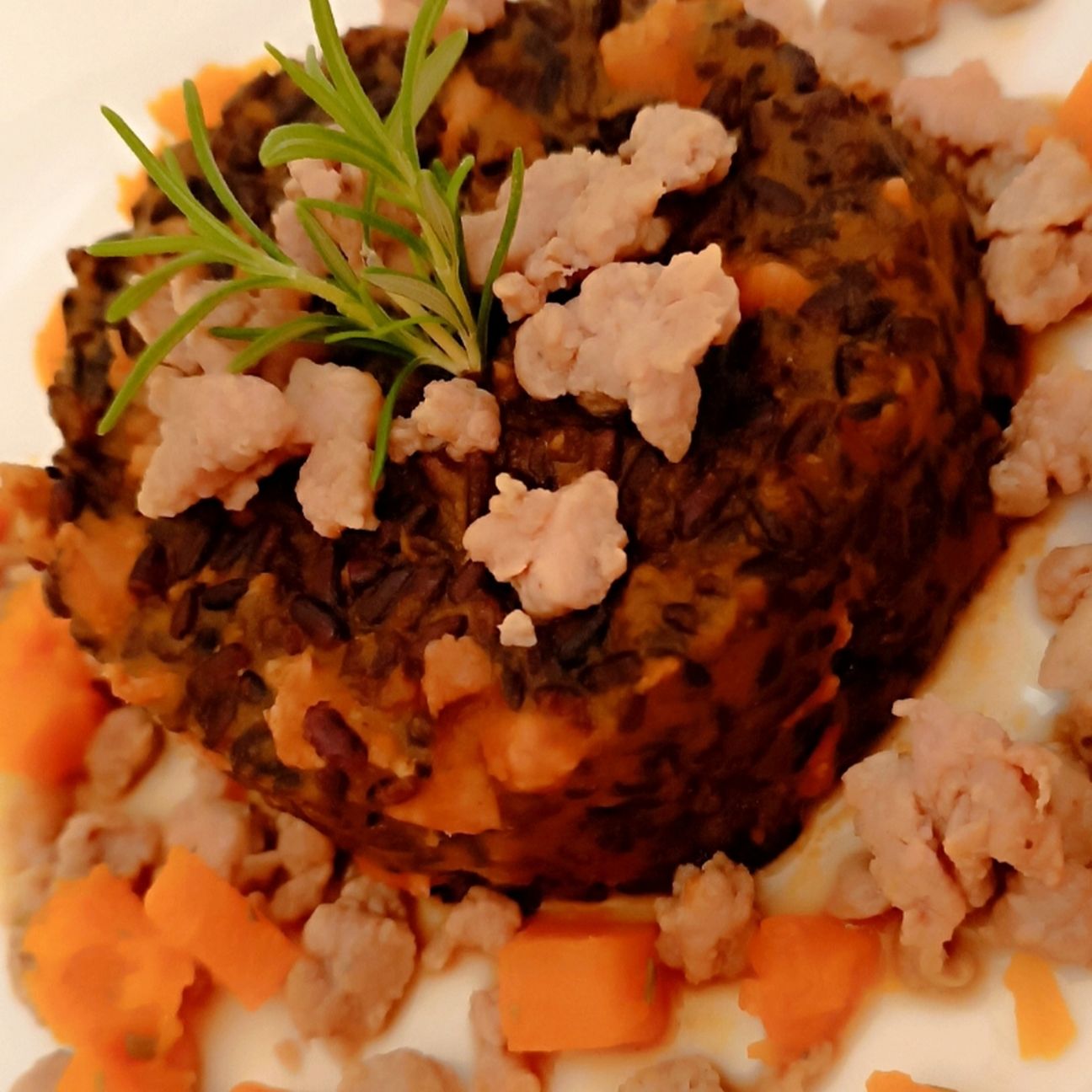 Riso venere con zucca e salsiccia