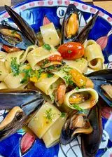 Ricetta Calamarata cozze e pomodorini gialli e rossi