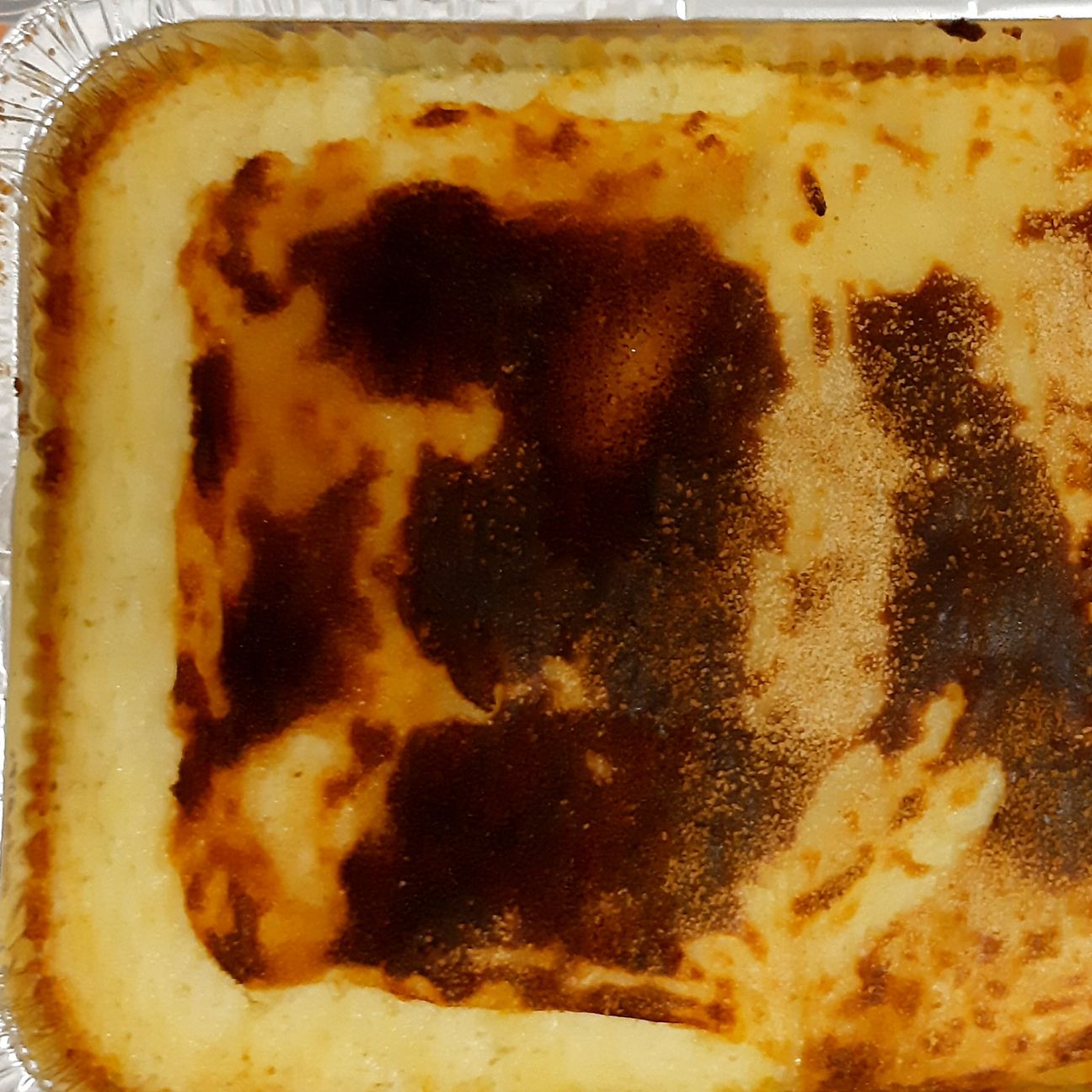 Pasticcio di purè, carne macinata e pane grattugiato