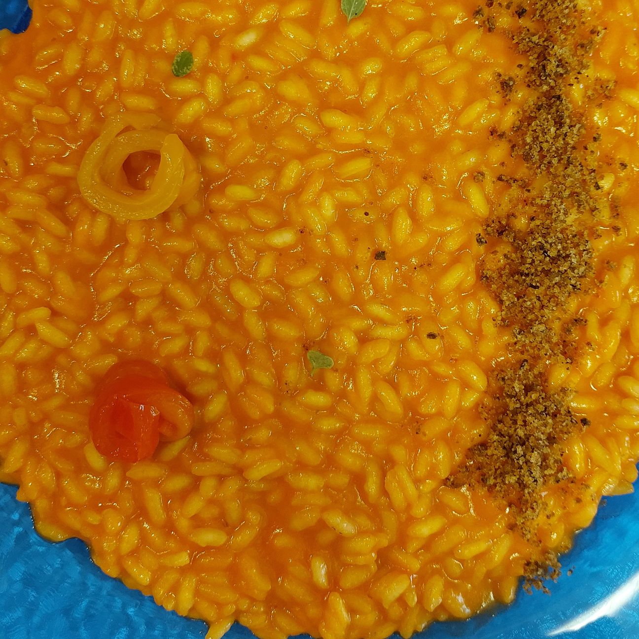 Risotto crema di peperoni e terra di olive taggiasche