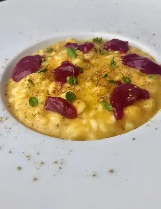 Ricetta Risotto alla zucca con coulis di lamponi, polvere di liquirizia e maggiorana di cucinodite