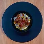 Ricetta Gnocco viola su crema di parmigiano reggiano, dadolata di zucchine e coppa di maiale croccante