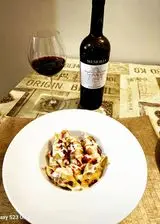 Ricetta Conchiglioni ripieni di ragù alla bolognese, con besciamella e fonduta di taleggio.