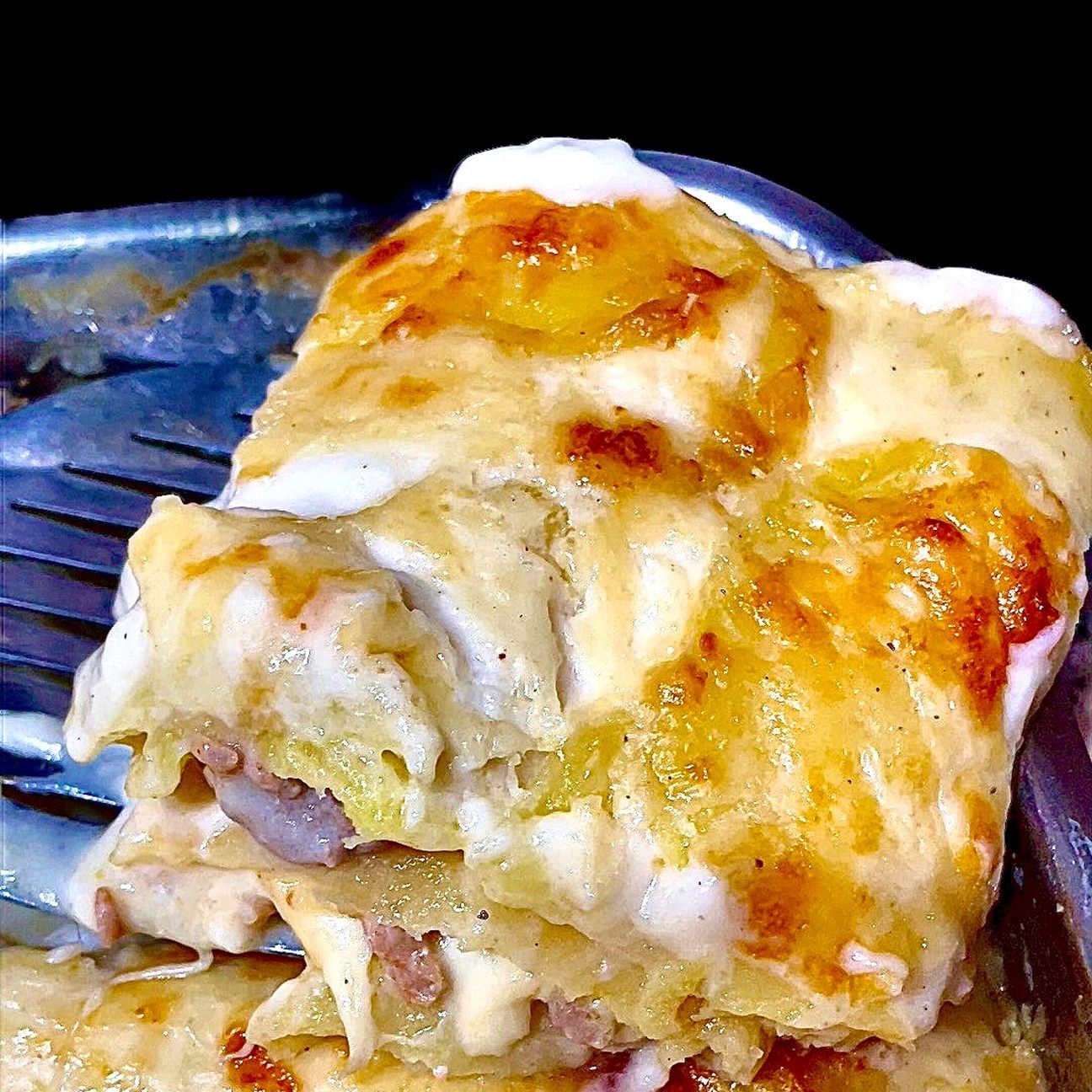 Parmigiana di patate e salsiccia