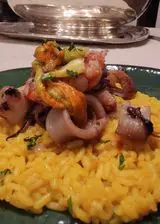 Ricetta Un risotto di mare color giallo zafferano.