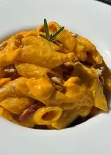 Ricetta Pennoni Garofalo con pesto di carote, noci e pancetta affumicata