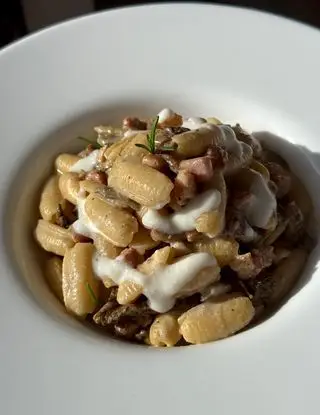 Ricetta Gnocchi sardi con porcini, pancetta affumicata e crema di parmigiano di midivertoacucinare