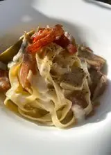 Ricetta Tagliatelle con carciofi, pancetta affumicata e crema di parmigiano