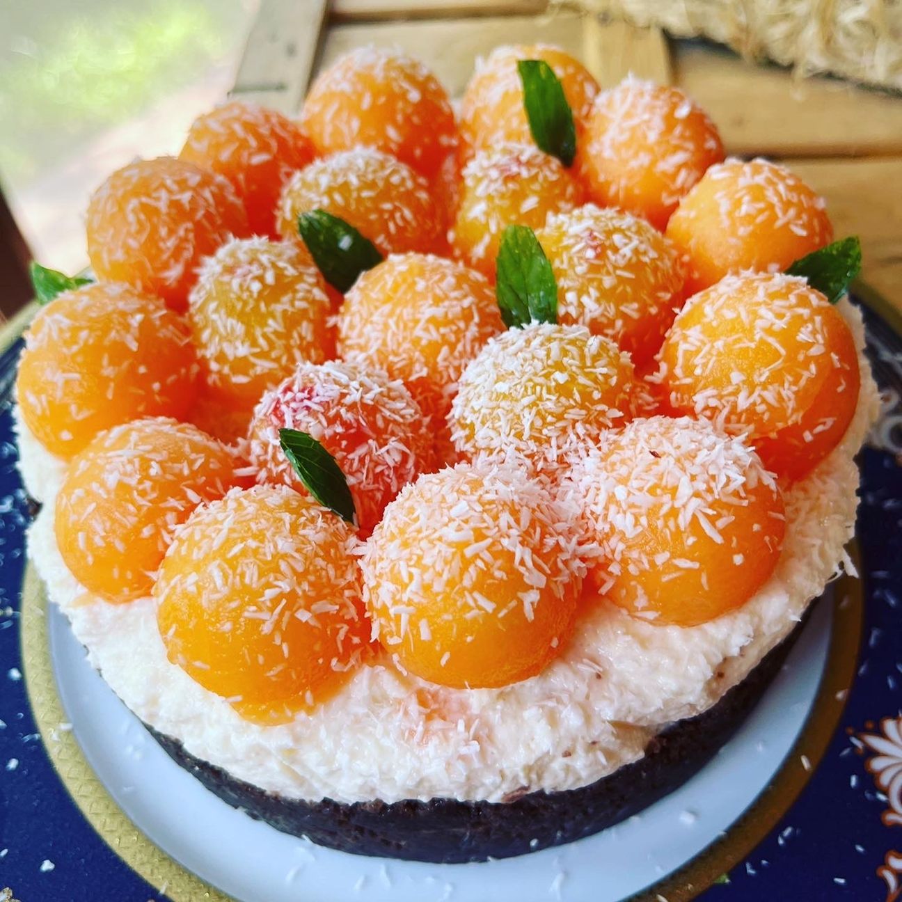 Cheesecake al melone , pesche e cocco rapè.